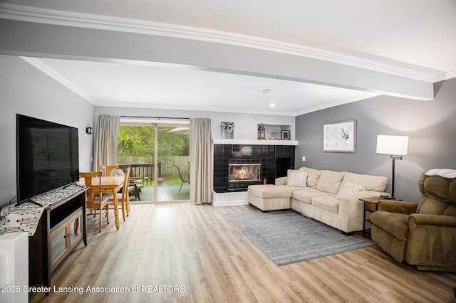 2022 Greenwich Ct, Lansing, MI 48910 - living area with wood finished floors, a fireplace, crown molding, and recessed lighting