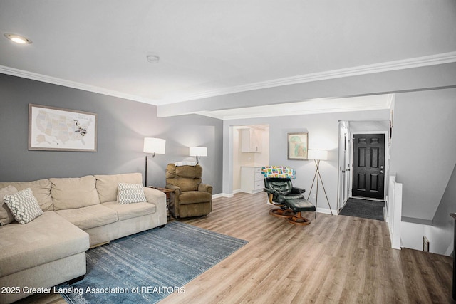 2022 Greenwich Ct, Lansing, MI 48910 - living area featuring wood finished floors, ornamental molding, and baseboards