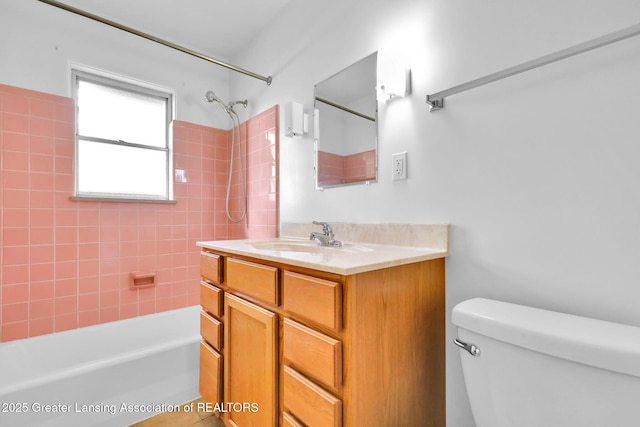 1450 N Hagadorn Rd, East Lansing, MI 48823 - full bath featuring shower / bathtub combination, vanity, and toilet