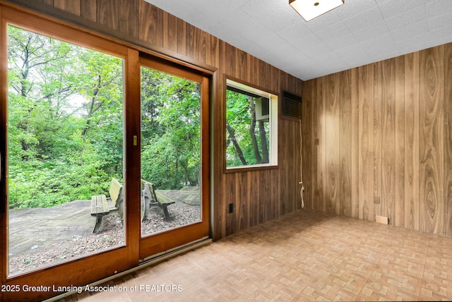 1450 N Hagadorn Rd, East Lansing, MI 48823 - spare room featuring wooden walls