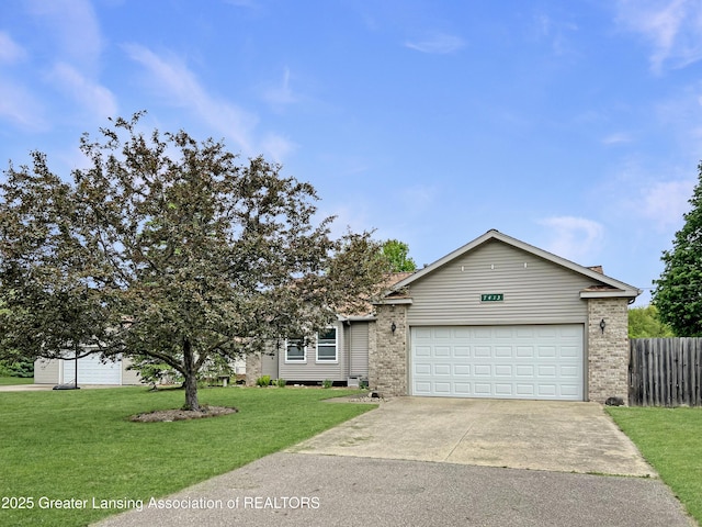 7413 E 5th Point Highway, Eaton Rapids, MI 48827 - view of front of property with concrete driveway, a garage, and brick siding