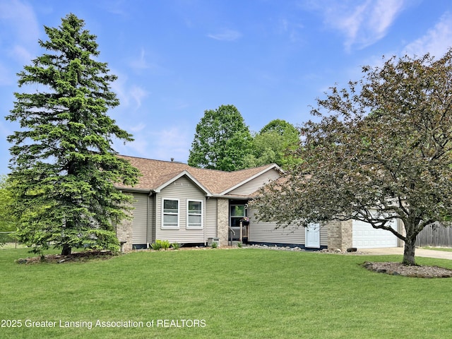 7413 E 5th Point Highway, Eaton Rapids, MI 48827 - view of front of house featuring a front yard, driveway, a garage, and a shingled roof