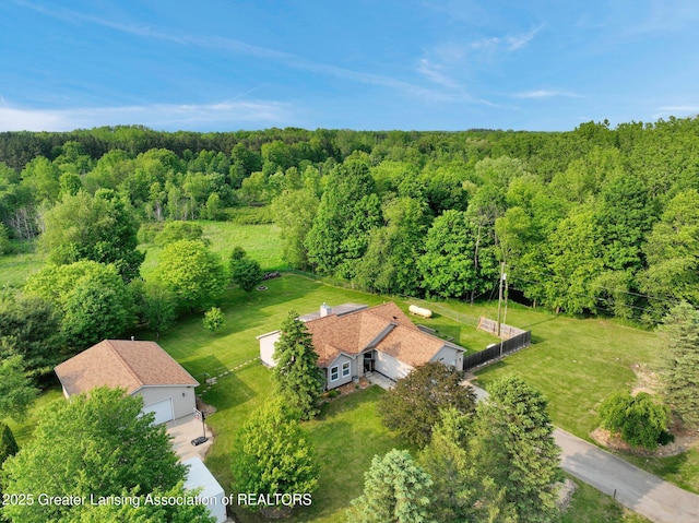 7413 E 5th Point Highway, Eaton Rapids, MI 48827 - view from above of property featuring a heavily wooded area