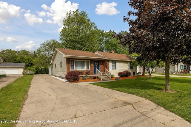 6187 Towar Ave, East Lansing, MI 48823 - view of front facade featuring brick siding, a chimney, and a front lawn