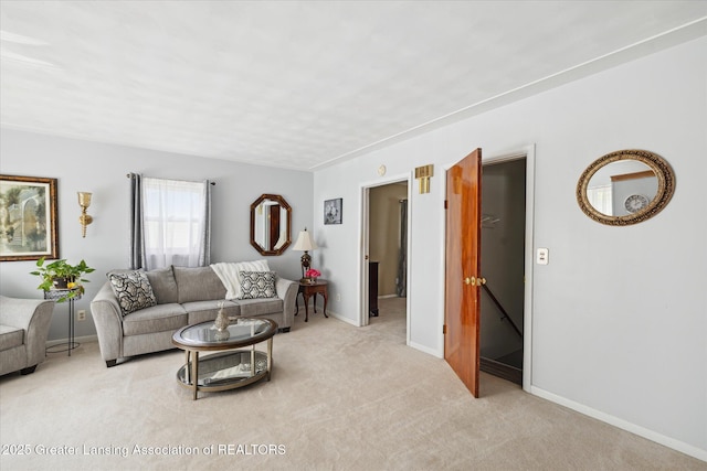 6187 Towar Ave, East Lansing, MI 48823 - living area with light carpet and baseboards