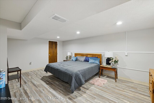 6187 Towar Ave, East Lansing, MI 48823 - bedroom featuring light wood-style floors, baseboards, and recessed lighting
