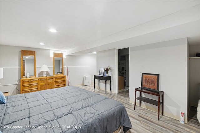 6187 Towar Ave, East Lansing, MI 48823 - bedroom featuring light wood-style flooring, recessed lighting, and baseboards