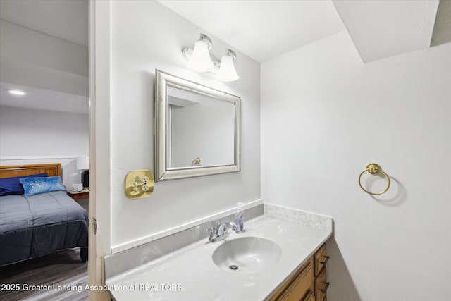6187 Towar Ave, East Lansing, MI 48823 - bathroom with vanity and ensuite bath