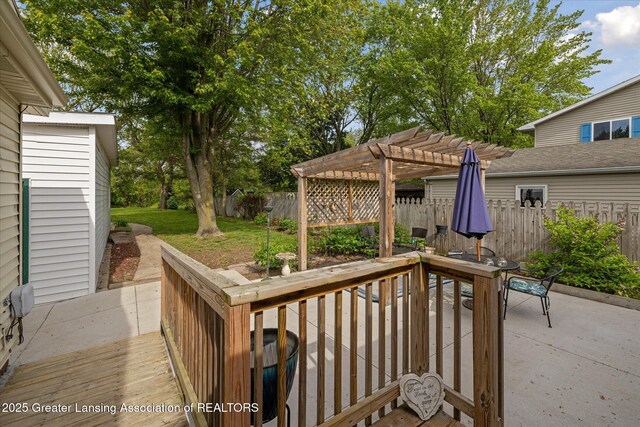 6187 Towar Ave, East Lansing, MI 48823 - wooden deck featuring a pergola, a patio area, and outdoor dining area