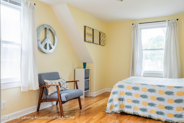 1311 Moores River Dr, Lansing, MI 48910 - bedroom featuring wood finished floors and baseboards