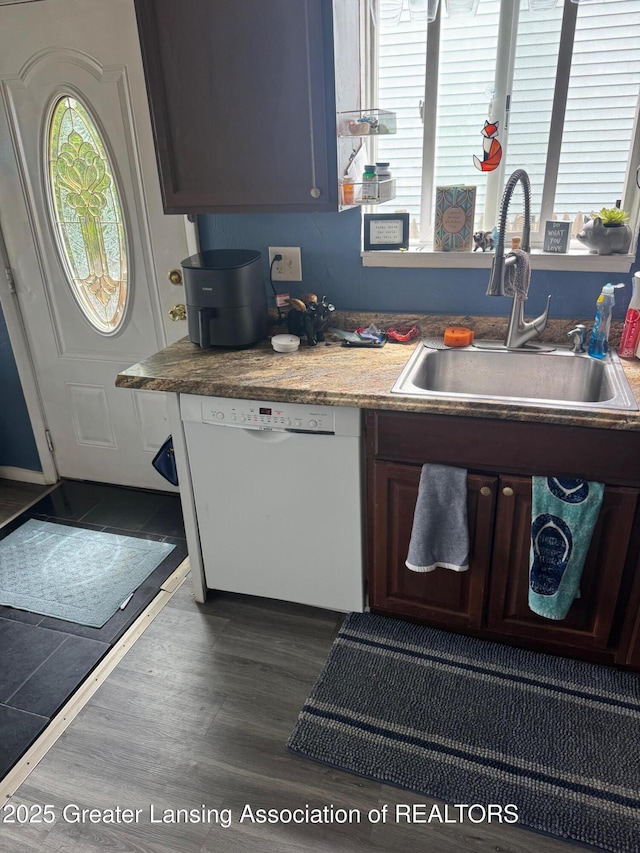 5880 Shaw St, Haslett, MI 48840 - kitchen with white dishwasher, a sink, plenty of natural light, and dark wood-type flooring