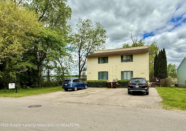 5880 Shaw St, Haslett, MI 48840 - view of front of house featuring uncovered parking