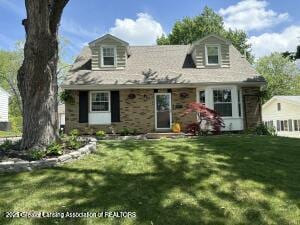 2024 Cogswell Dr, Lansing, MI 48906 - cape cod home with a front lawn