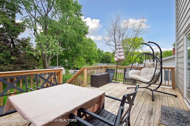2024 Cogswell Dr, Lansing, MI 48906 - wooden terrace featuring outdoor dining space