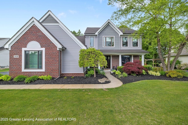 1232 Chemung Forest Dr, Howell, MI 48843 - traditional-style home with brick siding, a front lawn, and covered porch