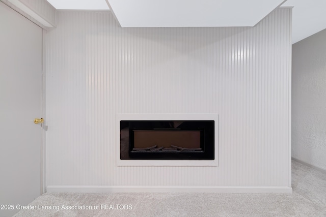 1232 Chemung Forest Dr, Howell, MI 48843 - detailed view of a fireplace and carpet floors