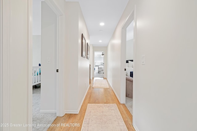 1232 Chemung Forest Dr, Howell, MI 48843 - hallway featuring light wood-style floors, baseboards, and recessed lighting
