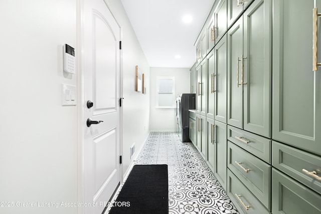1232 Chemung Forest Dr, Howell, MI 48843 - corridor featuring washing machine and dryer, light tile patterned flooring, baseboards, and recessed lighting