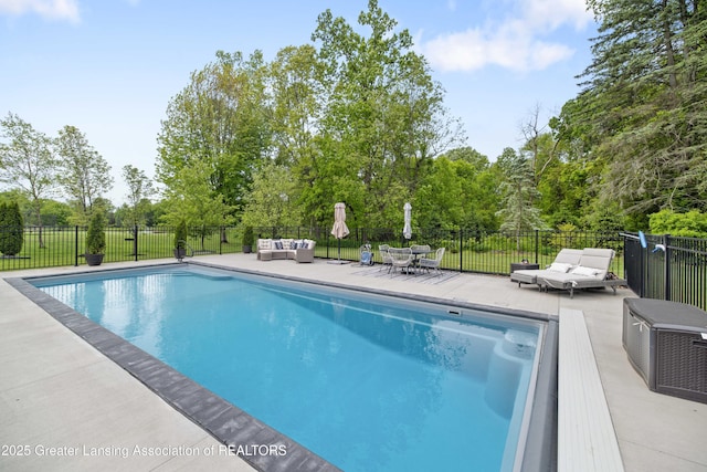 1232 Chemung Forest Dr, Howell, MI 48843 - view of swimming pool with an outdoor hangout area, a patio area, and view of scattered trees
