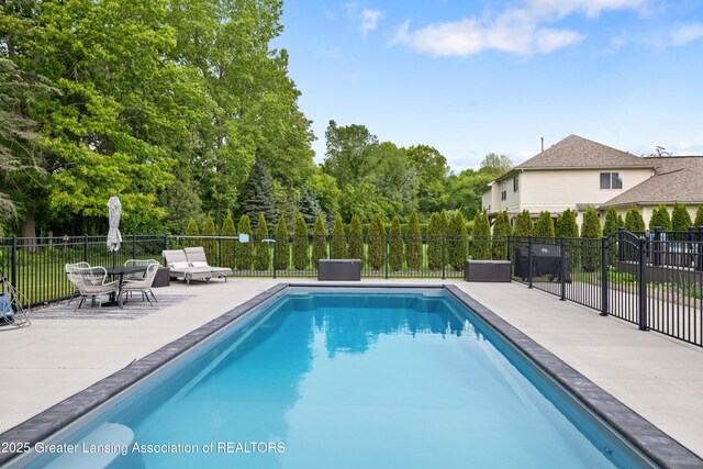 1232 Chemung Forest Dr, Howell, MI 48843 - view of swimming pool with a patio area