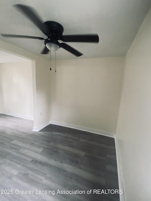 3319 Westmont Ave, Lansing, MI 48906 - empty room with ceiling fan, dark wood finished floors, and baseboards