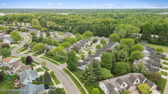 1101 Boulder Ct Unit 48, Lansing, MI 48917 - aerial view of residential area with a heavily wooded area