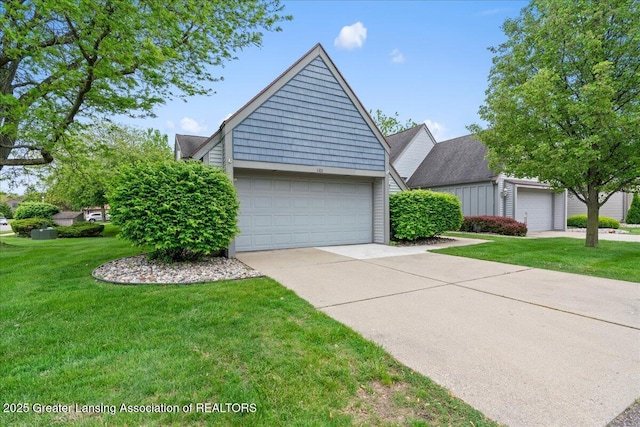 1101 Boulder Ct Unit 48, Lansing, MI 48917 - view of front of property with a front yard and driveway