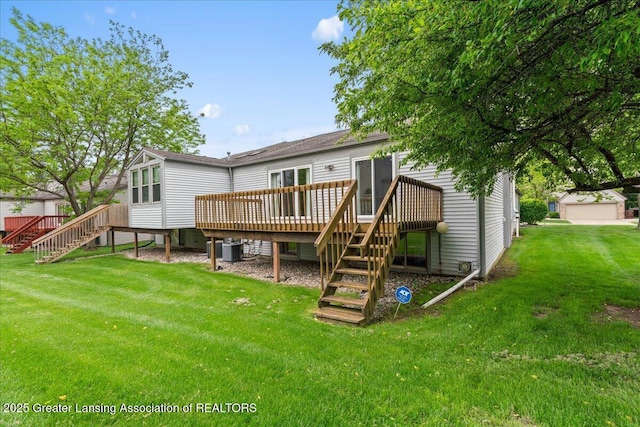 1101 Boulder Ct Unit 48, Lansing, MI 48917 - back of property featuring stairs, a deck, central AC unit, and a yard