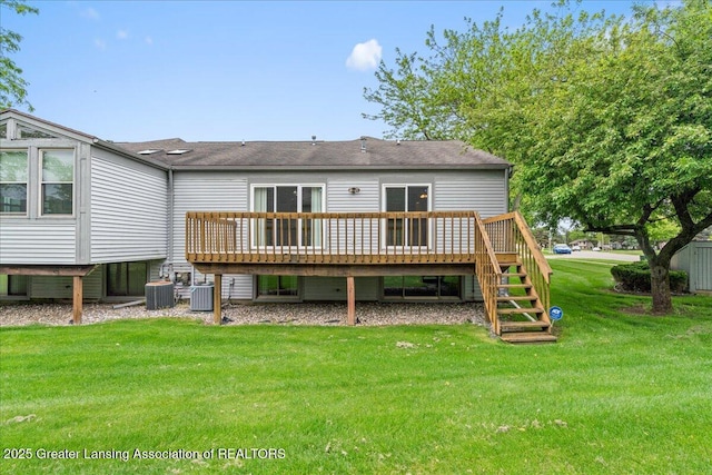1101 Boulder Ct Unit 48, Lansing, MI 48917 - rear view of house with central AC, a yard, a deck, and stairway