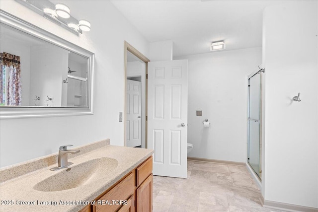 1101 Boulder Ct Unit 48, Lansing, MI 48917 - full bath featuring vanity, a shower with door, and toilet