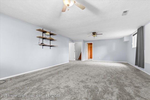 1101 Boulder Ct Unit 48, Lansing, MI 48917 - unfurnished room featuring a ceiling fan, carpet flooring, baseboards, and a textured ceiling