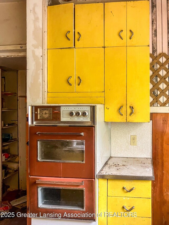 908 N Capitol Ave, Lansing, MI 48906 - kitchen featuring multiple ovens, yellow cabinets, and green cabinets