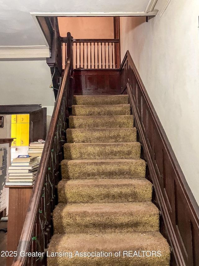 908 N Capitol Ave, Lansing, MI 48906 - stairs featuring crown molding