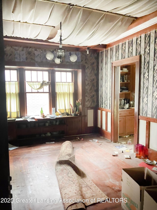 908 N Capitol Ave, Lansing, MI 48906 - empty room with wallpapered walls and healthy amount of natural light