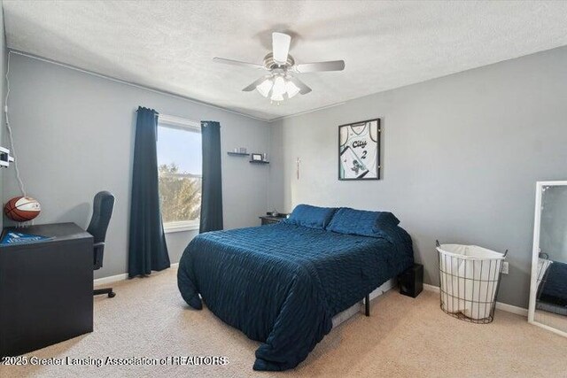 2166 W Winners Cir, Saint Johns, MI 48879 - carpeted bedroom featuring a desk and a ceiling fan