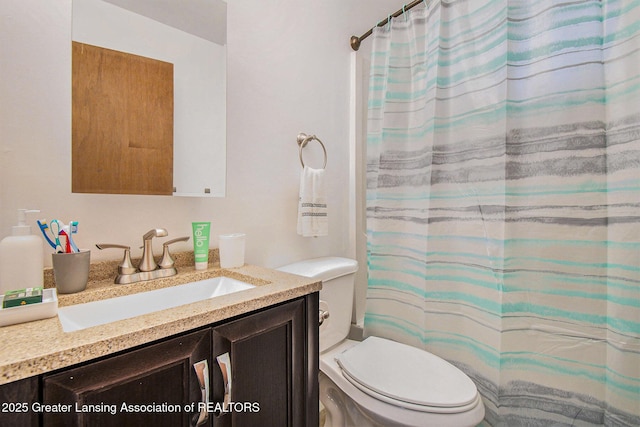 2104 Clifton Ave, Lansing, MI 48910 - bathroom with vanity, toilet, and a shower with curtain