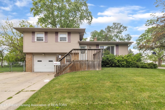 1021 Kendon Dr, Lansing, MI 48910 - split level home featuring driveway, a garage, brick siding, stairway, and a chimney