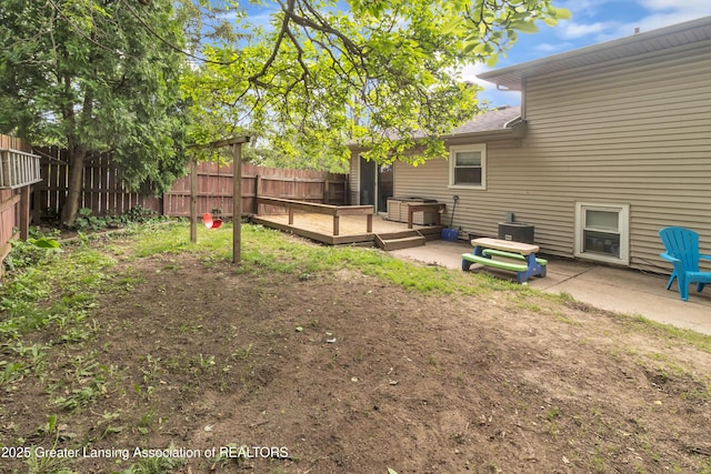1021 Kendon Dr, Lansing, MI 48910 - view of yard with a wooden deck and a patio