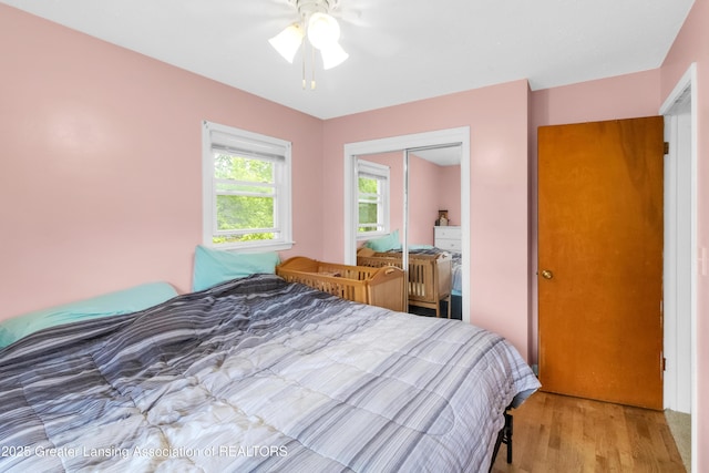 1021 Kendon Dr, Lansing, MI 48910 - bedroom featuring a closet, light wood finished floors, and ceiling fan