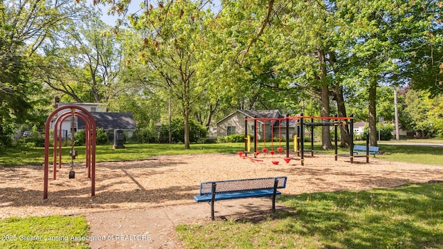 621 Ridgewood Ave, Lansing, MI 48910 - community play area with a yard and view of wooded area