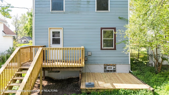 621 Ridgewood Ave, Lansing, MI 48910 - rear view of property with a wooden deck and stairway