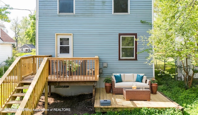 621 Ridgewood Ave, Lansing, MI 48910 - back of property featuring a wooden deck, outdoor lounge area, and stairs