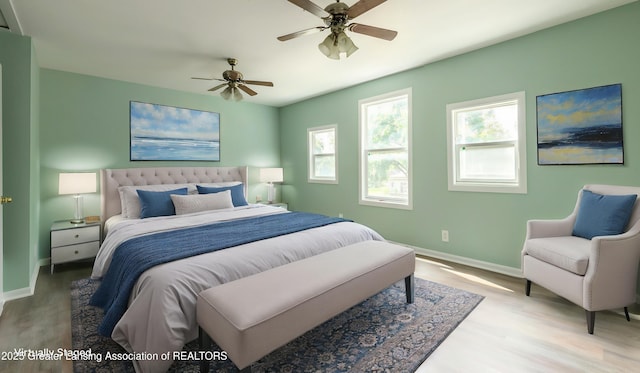 621 Ridgewood Ave, Lansing, MI 48910 - bedroom featuring wood finished floors, baseboards, and ceiling fan