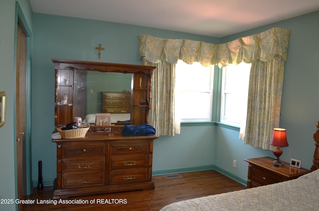 1161 Rebecca Rd, East Lansing, MI 48823 - bedroom with wood finished floors and baseboards