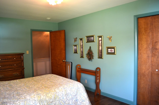 1161 Rebecca Rd, East Lansing, MI 48823 - bedroom with dark wood-style flooring and baseboards