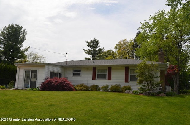 1161 Rebecca Rd, East Lansing, MI 48823 - view of front of property featuring a chimney and a front yard