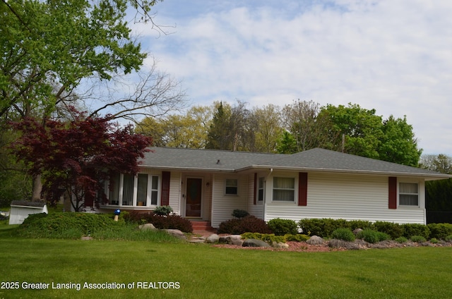 1161 Rebecca Rd, East Lansing, MI 48823 - ranch-style house with a front yard and roof with shingles