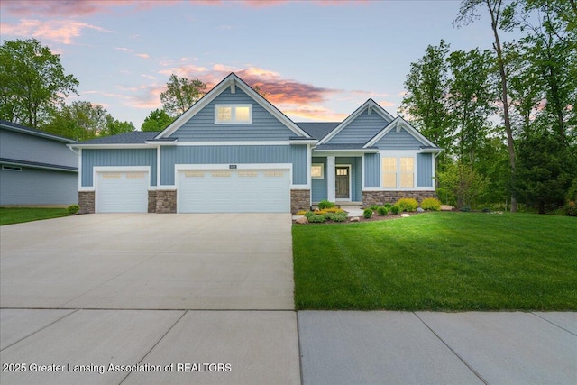 6619 Windford Ln, Grand Ledge, MI 48837 - craftsman-style home featuring stone siding, board and batten siding, driveway, and an attached garage