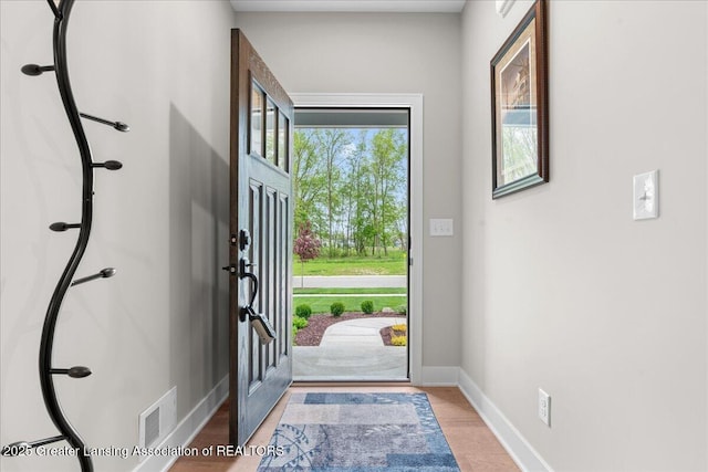 6619 Windford Ln, Grand Ledge, MI 48837 - foyer entrance with baseboards and wood finished floors