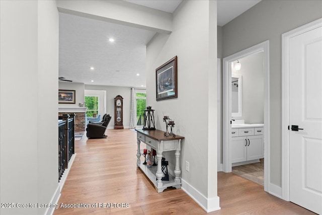 6619 Windford Ln, Grand Ledge, MI 48837 - hallway featuring baseboards, light wood finished floors, and recessed lighting